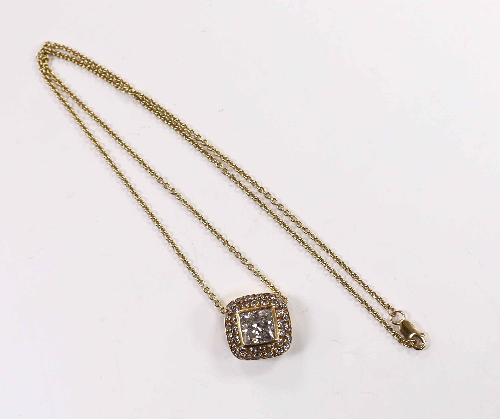 A modern 14ct gold and simulated diamond cluster set pendant necklace, 41cm and a pair of matching ear clips, gross weight 23 grams.